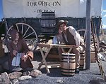 Rebecca Crow and Brandon Kames portray a pioneer couple at a wagon encampment.