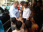 Assistant Secretary Schwartz Is Greeted By Children in Geneva Camp