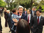 Secretary Kerry Laughs After Getting a Hug from a Japanese Child at Zojoji Shrine