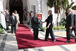 Secretary Clinton Shakes Hands With Bouteflika