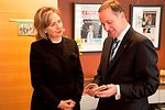 New Zealand Prime Minister Key Looks at a Gift Given By the Secretary
