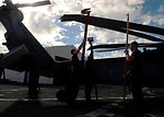 Crew Members from Helicopter Sea Combat Squadron 23 “Wild Cards” Unfasten the Blades of an MH-60S Knighthawk Helicopter