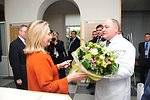 Secretary Clinton Receives Flowers From Women's Wellness Center Staff