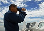 Ordinary Seaman Catalan Looks Through Binoculars