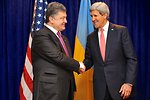 Secretary Kerry Shakes Hands With Ukrainian President-elect Poroshenko Before Meeting in Warsaw