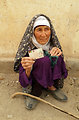 An elderly woman posing for a photo after casting her vote in Badghis province.