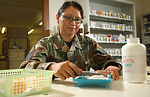 Sergeant filling prescriptions on Air Force birthday