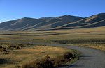 Centennial Valley road with mountains in the background