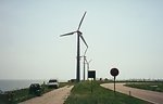 Wind power as practiced in the Twenty-first Century.  A series of electricity generating windmills making use of available space. 