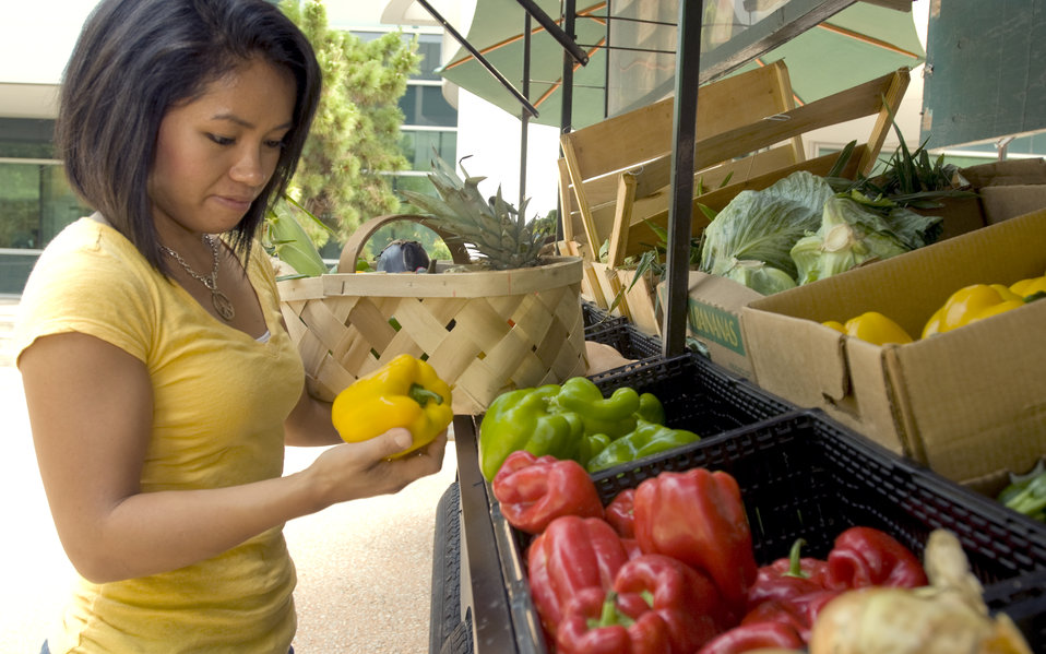 A woman shopping for produce