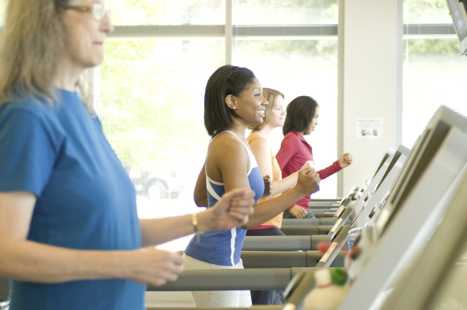 Women running on treadmills