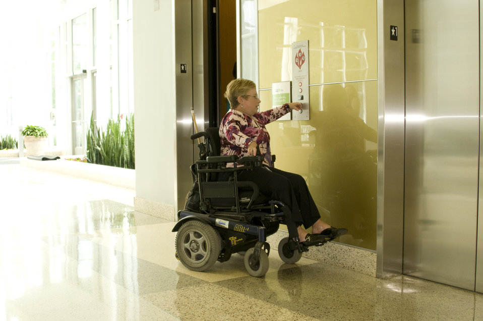 Seated in her wheelchair, the woman pictured here had reached the elevator doors inside a building on one of the Centers for Disease Control