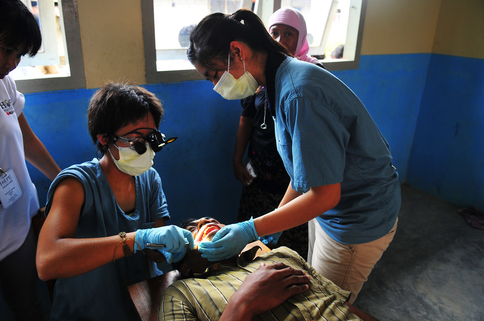 Sussi Yamaguchi Examines a Local Indonesian Patient