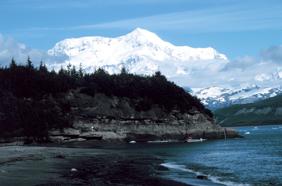  Photo #7 of Mount St. Elias sequence. Mount Saint Elias is one of the largest mountains visible from the sea on the North American continent.  It rises to a height of 18,008 feet in a distance of less than 20 miles from sea level at Icy Bay. 
