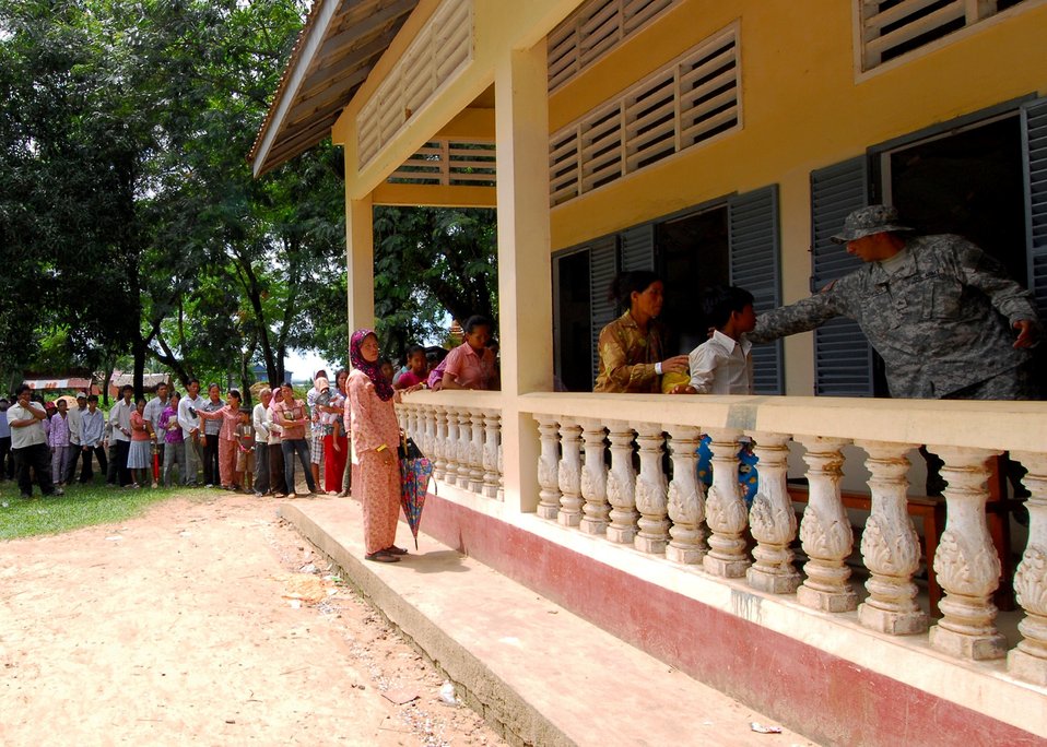 U.S. Army Sgt. John Garcia Directs Patients to the Pharmacy