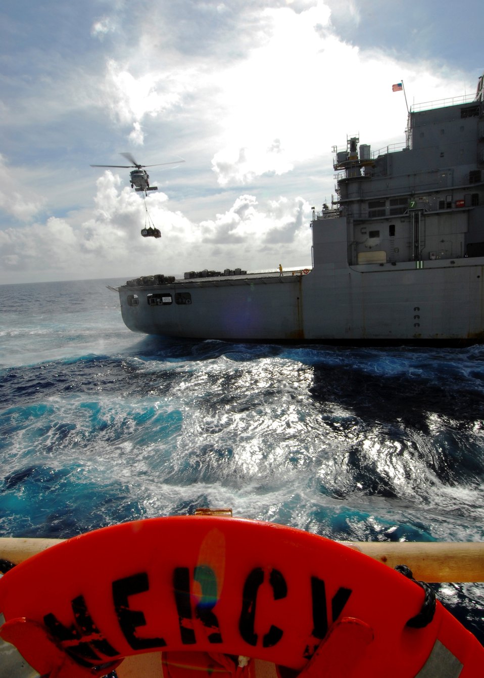 An MH-60S Knighthawk Helicopter Conducts a Vertical Replenishment (VERTREP) With Dry Cargo/ Ammunition Ship USNS Richard E. Byrd (T-AKE 4)