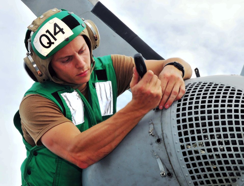 Aviation Electronics Technician 3rd Class Evan Dunham, with Helicopter Combat Squadron 23 “Wildcards,” Inspects an MH-60S Knighthawk