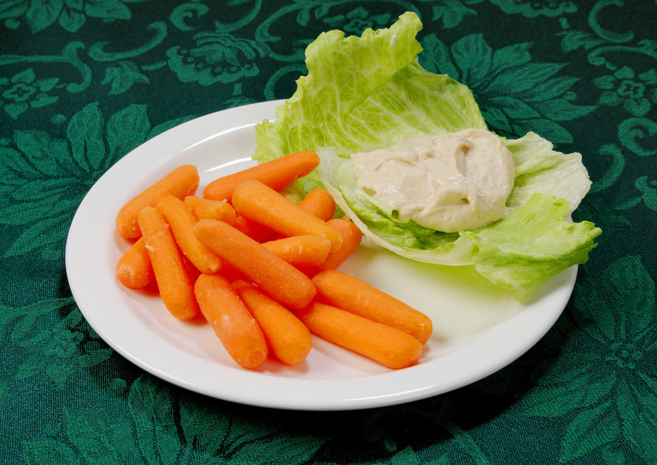 The carrots on this plate are an excellent source of Vitamin A, which is necessary for healthy eyesight, skin, growth, and also aids our bod