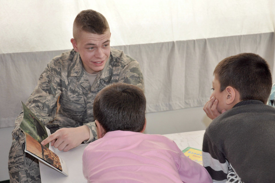 NTM-A members participate in reading program in Kabul school