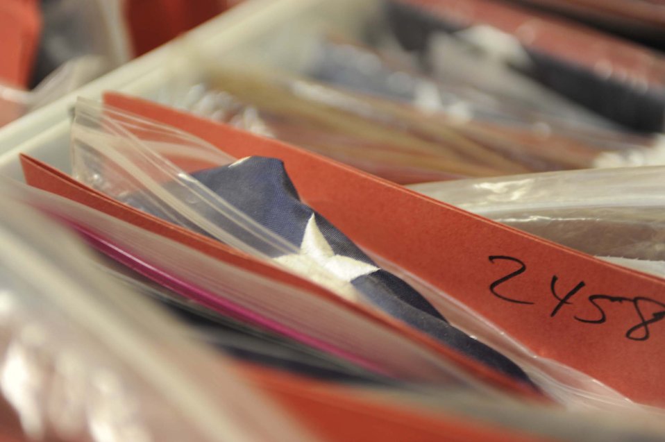 451st AEW members give flags wings to fly