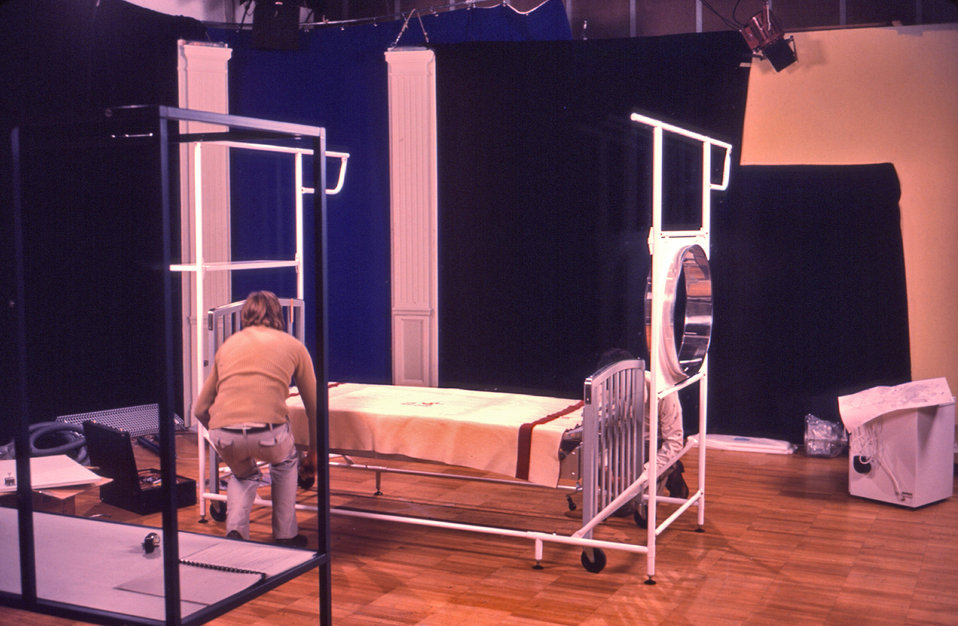 This photograph depicted a technician assembling a Vicker's bed isolator that was on display at the CDC in 1977. This type of isolation unit