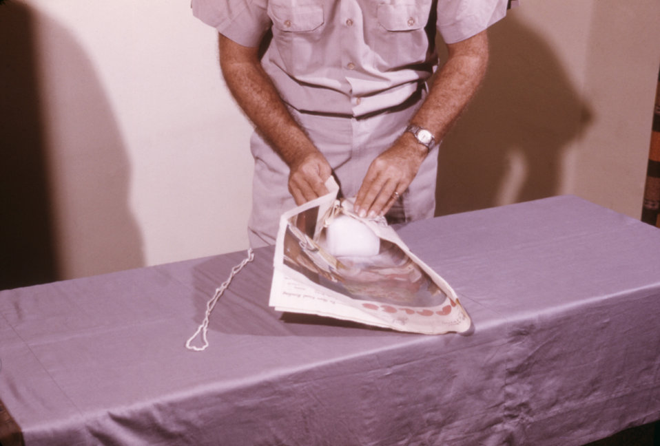 Public Domain Picture This CDC field researcher is shown preparing a block of dry ice, which