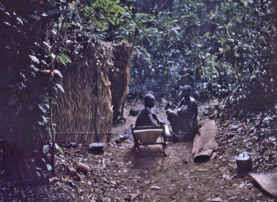 This 1969 photograph depicted a Dekina, Nigerian family as they were seated in front of their home during a smallpox investigation.