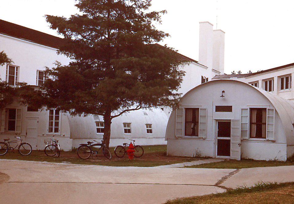 This historic image depicted the Quonset huts that were erected on the grounds of the Carville, Louisiana Leprosarium, for the purpose of ac