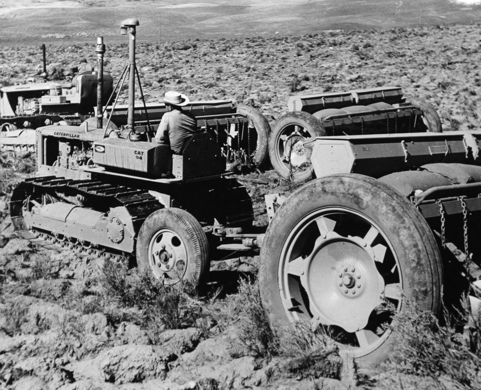 Rangeland sagebrush plows/seeders in operation.  Common practice to restore depleted rangelands.  circa 1950s
