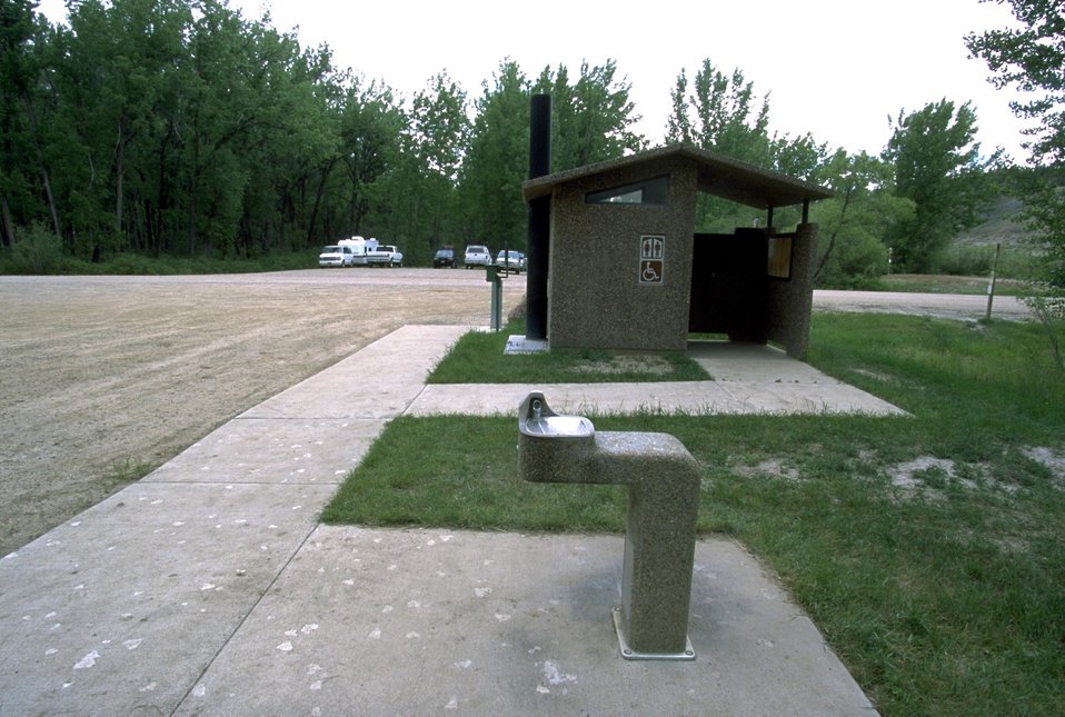 Drinking Fountain, outhouse and parking lot at Kipp Recreation Site