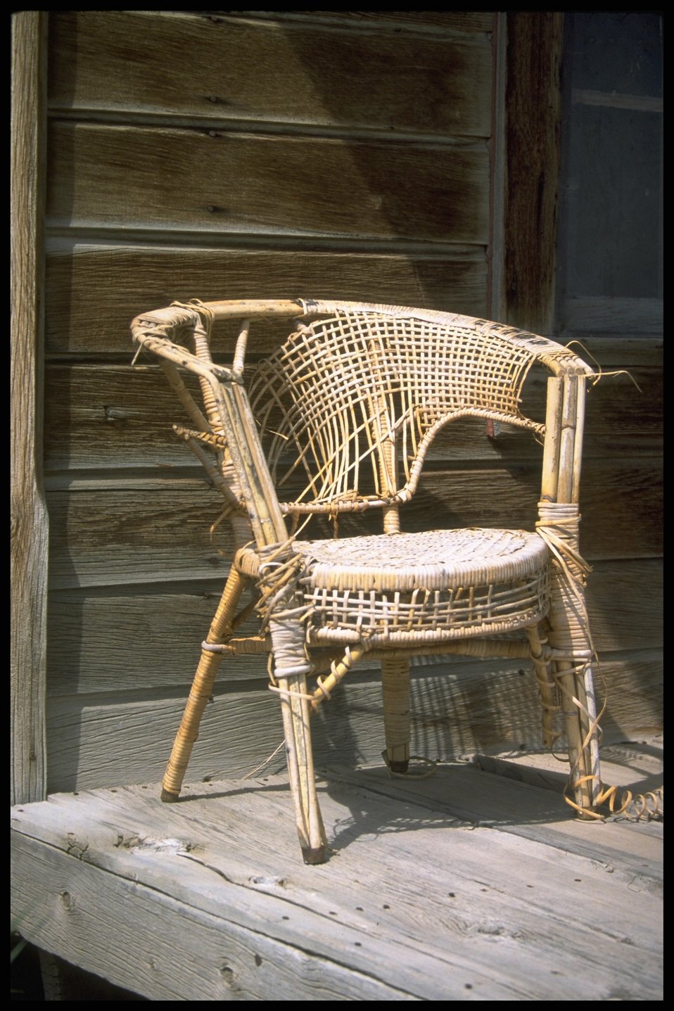 Old wicker chair on porch at the Shirk Ranch, Lakeview District.