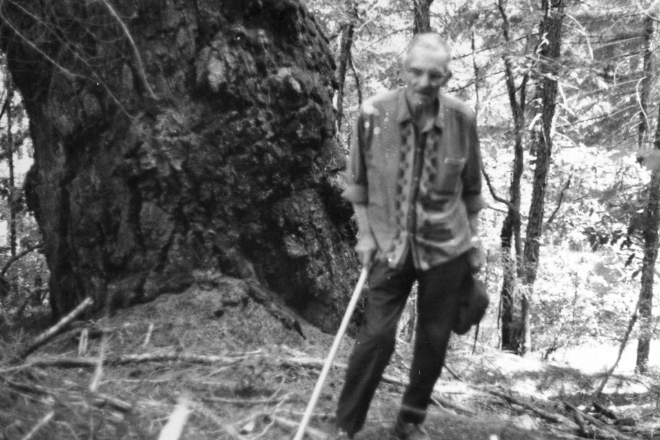 Ivin Billings looking at graves a Mule Creek by the old U.S.F.S Gaurd station.